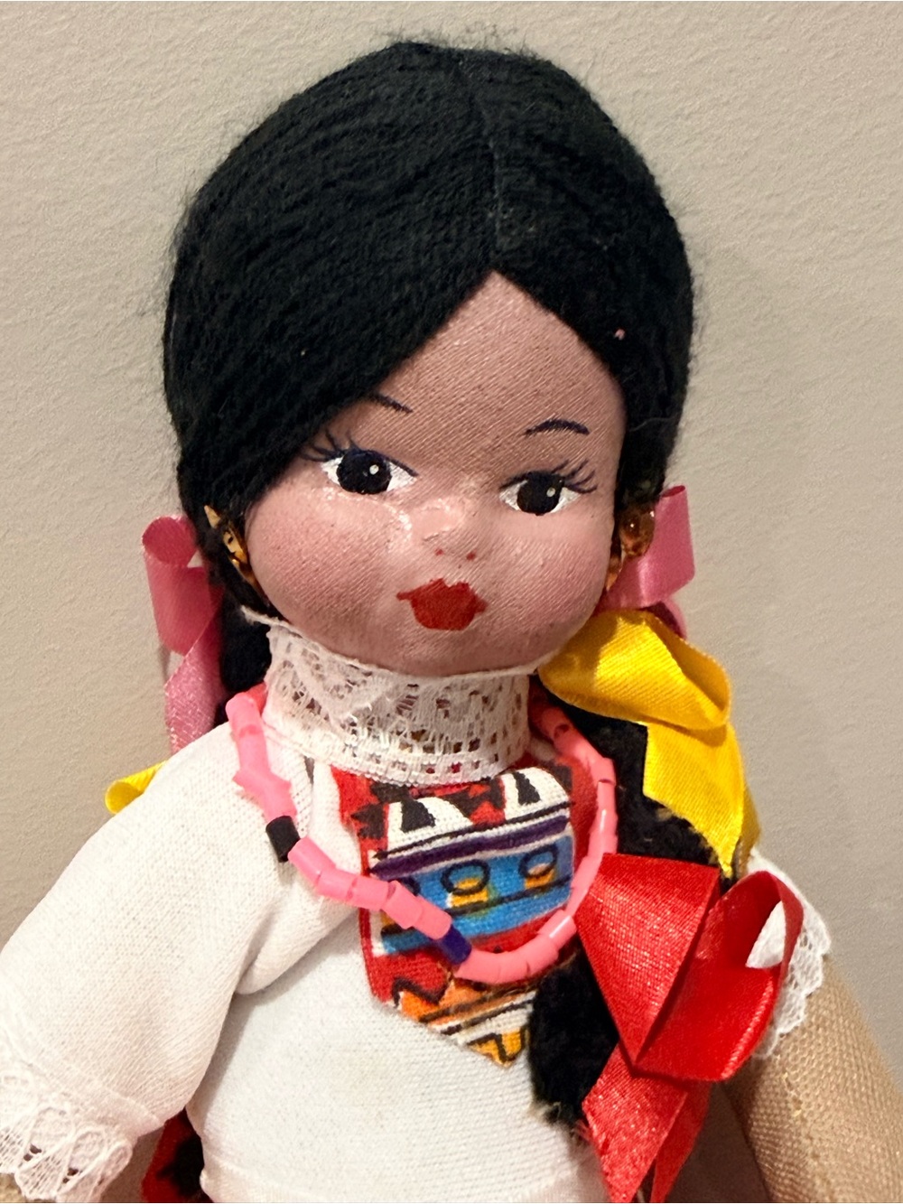 Vintage Mexican cloth souvenir doll dressed in a colorful traditional-style folk
